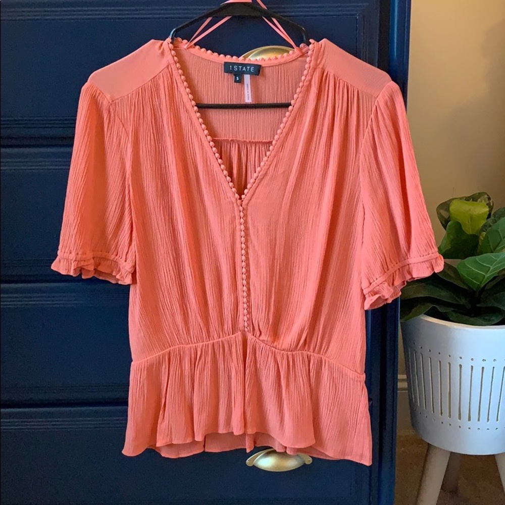 1. State circle trim peplum top